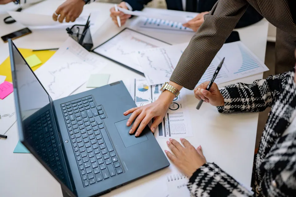 A team reviewing business data and charts